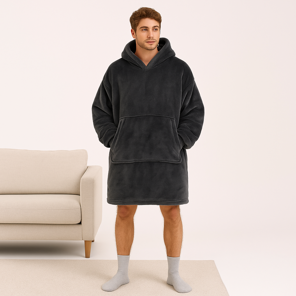 Dark grey oversized hoodie blanket on male model – front view