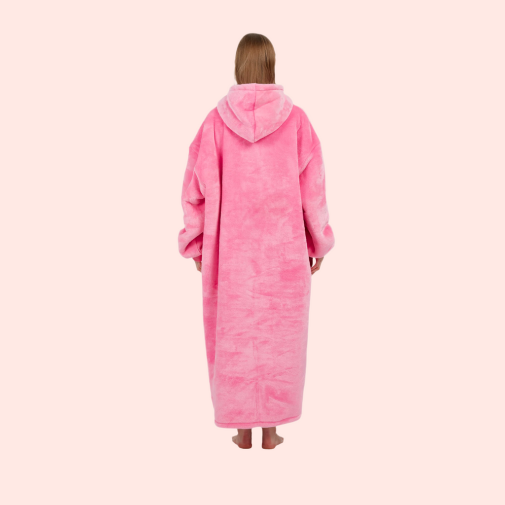 Back view of cozy bright pink hoodie blanket with hood up.