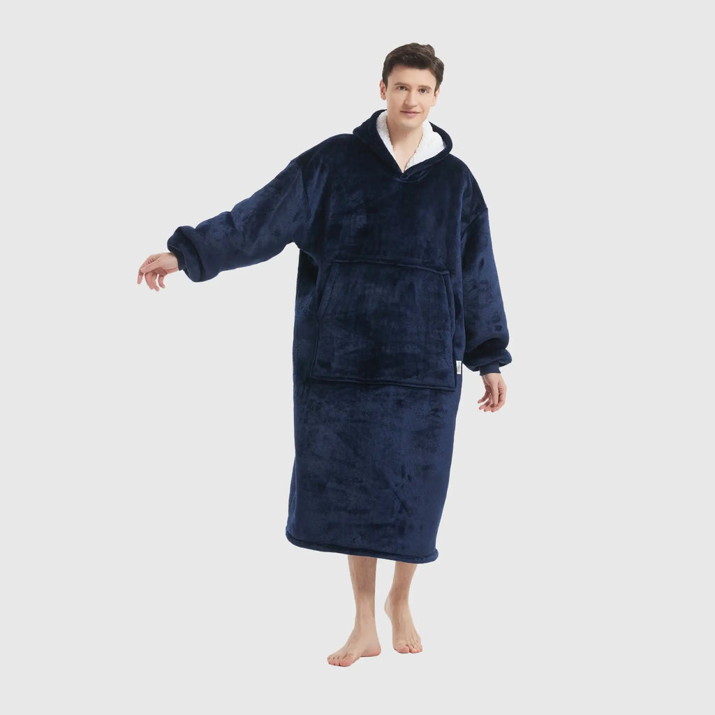 Profile view of navy oversized blanket hoodie in motion on male model